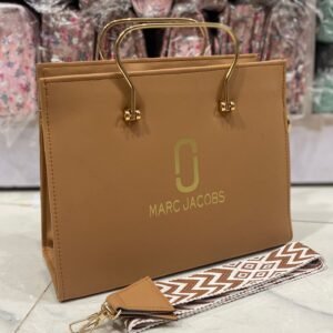 womens luxury handbag with gold handles and crossbody strap