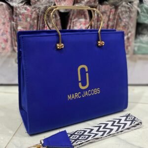 womens luxury handbag with gold handles and crossbody strap