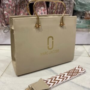 womens luxury handbag with gold handles and crossbody strap