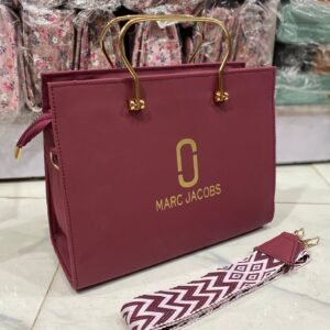 womens luxury handbag with gold handles and crossbody strap